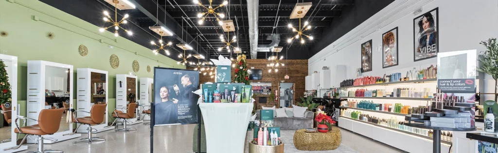 - The Color Bar, TX Modern hair salon interior with styling stations, product displays, wall art, and decorative lighting. Expert hair stylists work in a brightly lit space featuring contemporary fixtures and a clean, organized layout. - The Color Bar, TX